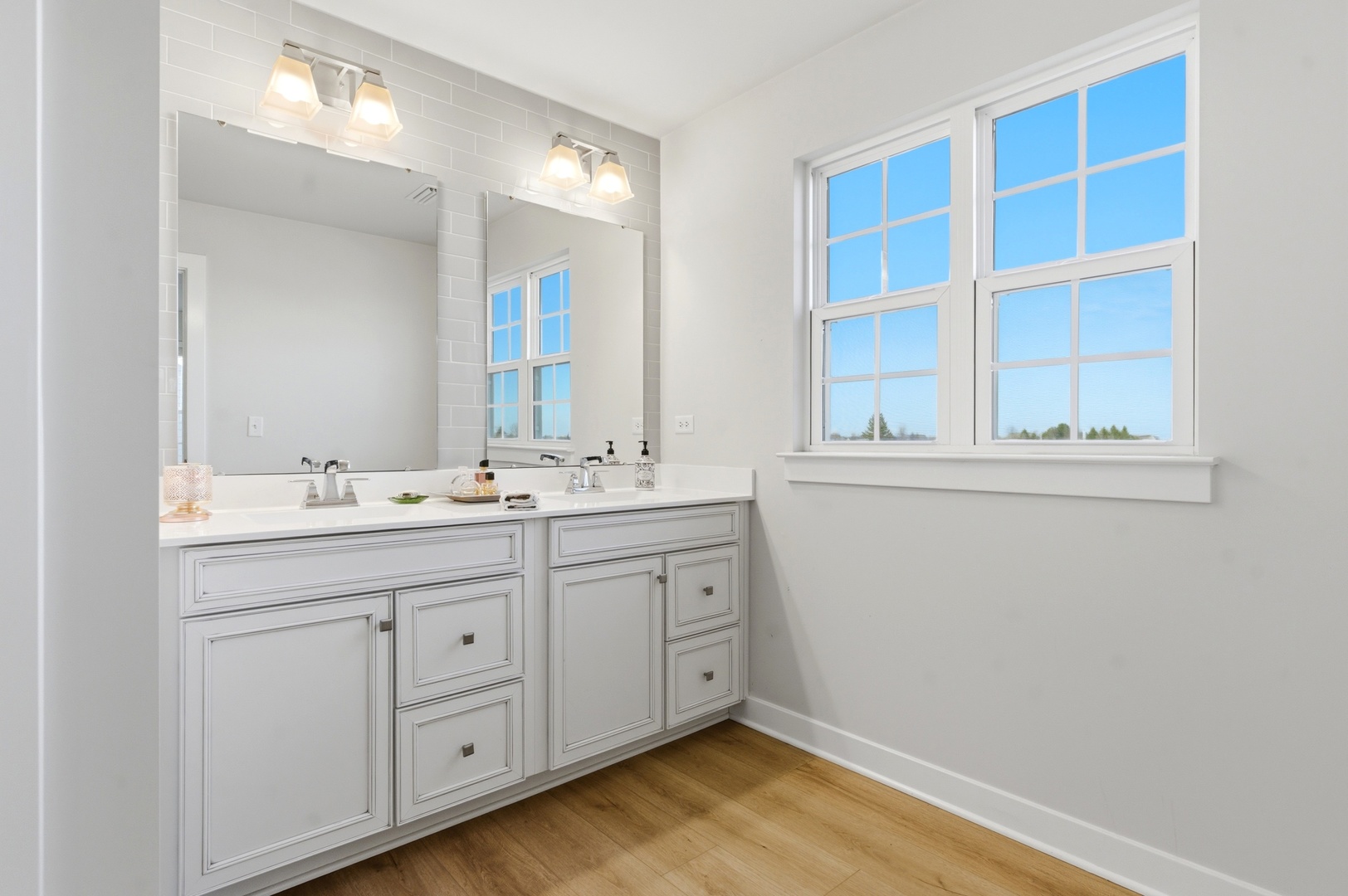 306 Atkinson Drive Sugar Grove, IL 60554 - Photo 24 of 50 a bathroom with a sink and a mirror