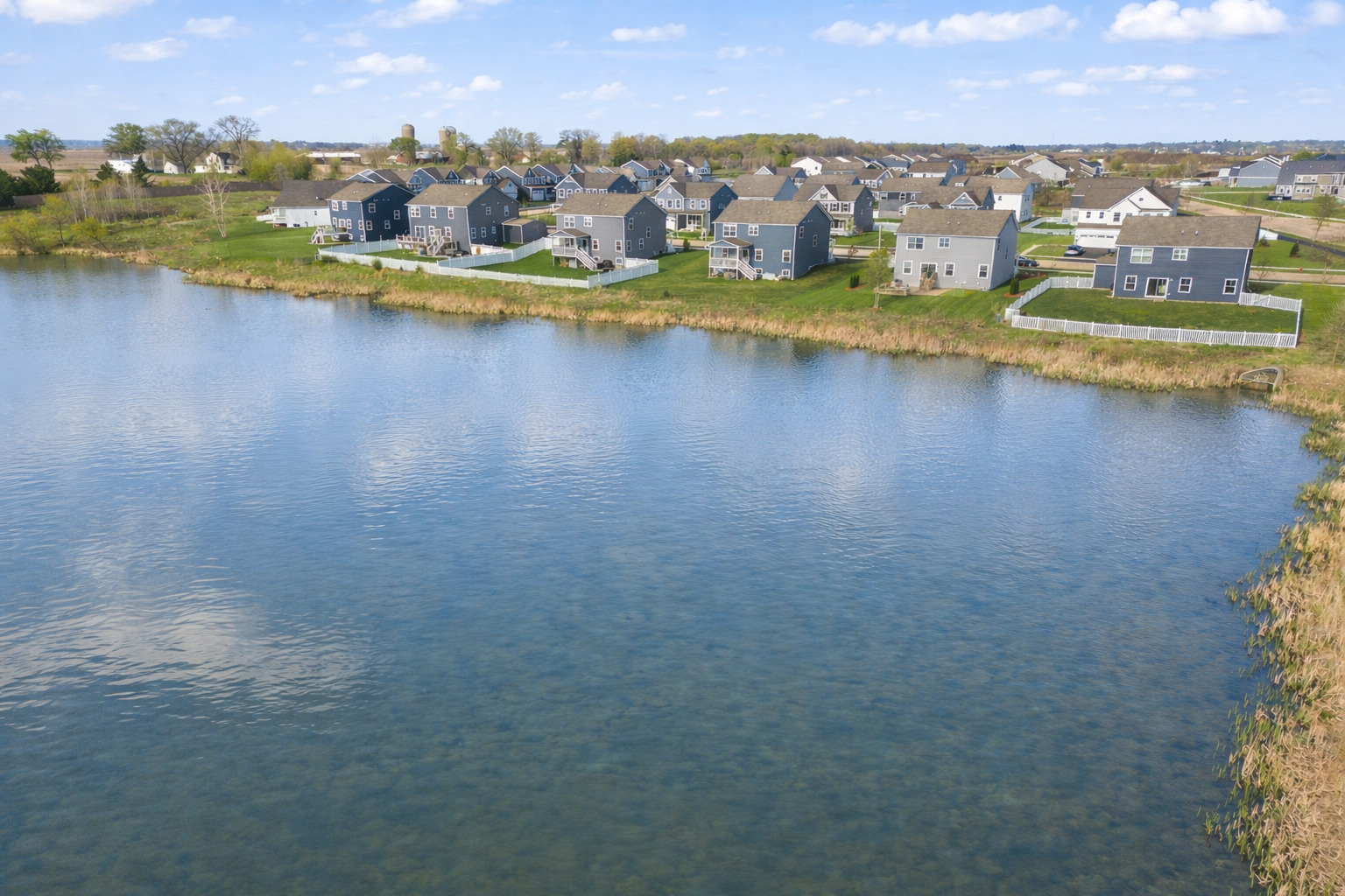 306 Atkinson Drive Sugar Grove, IL 60554 - Photo 44 of 50 an aerial view of a city with lots of residential buildings lake and ocean view