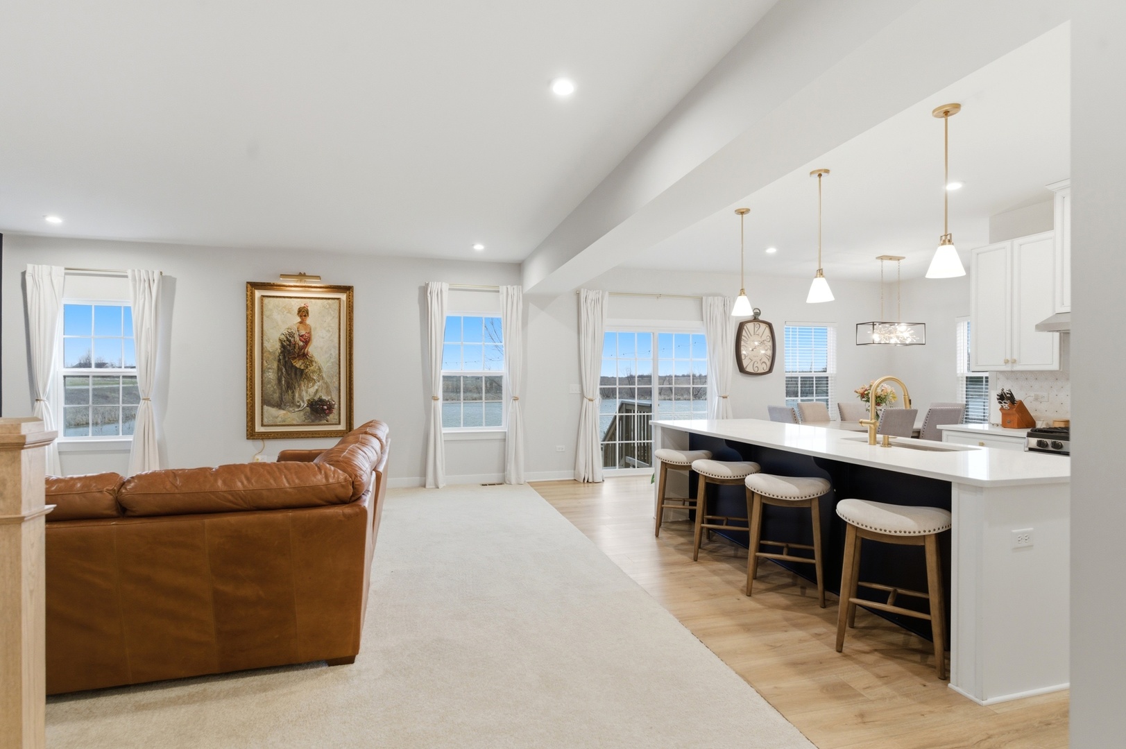 306 Atkinson Drive Sugar Grove, IL 60554 - Photo 8 of 50 a living room with furniture a wooden floor and kitchen view