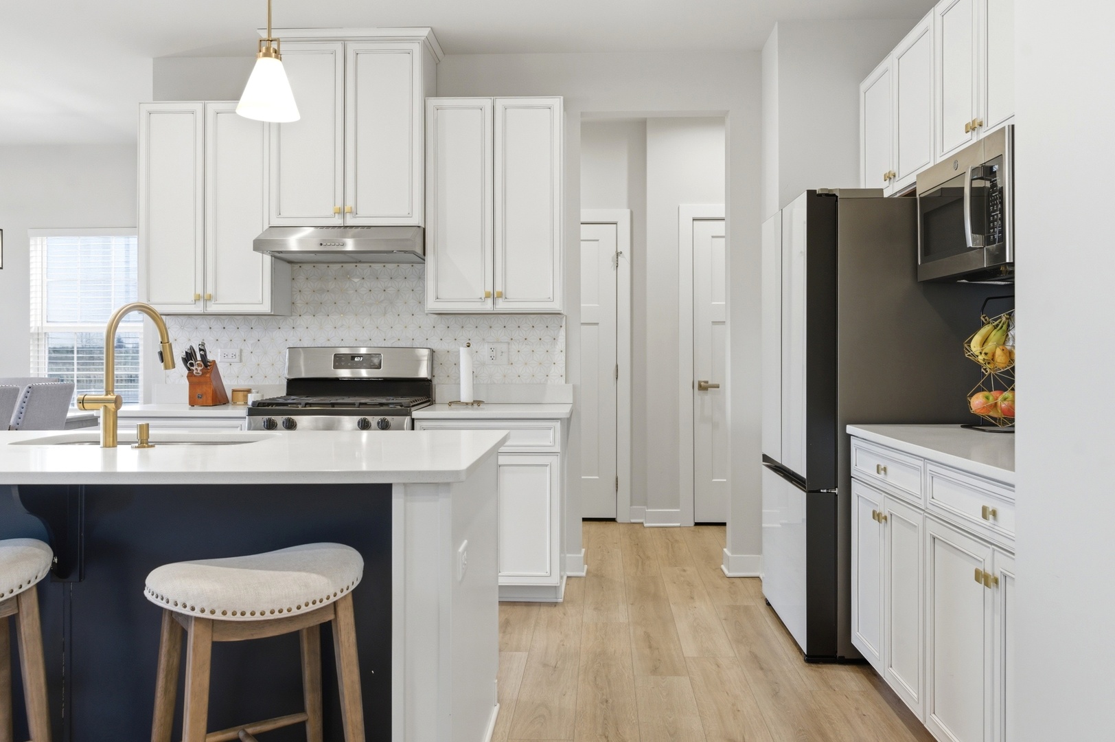306 Atkinson Drive Sugar Grove, IL 60554 - Photo 10 of 50 a kitchen with stainless steel appliances a sink cabinets and wooden floor