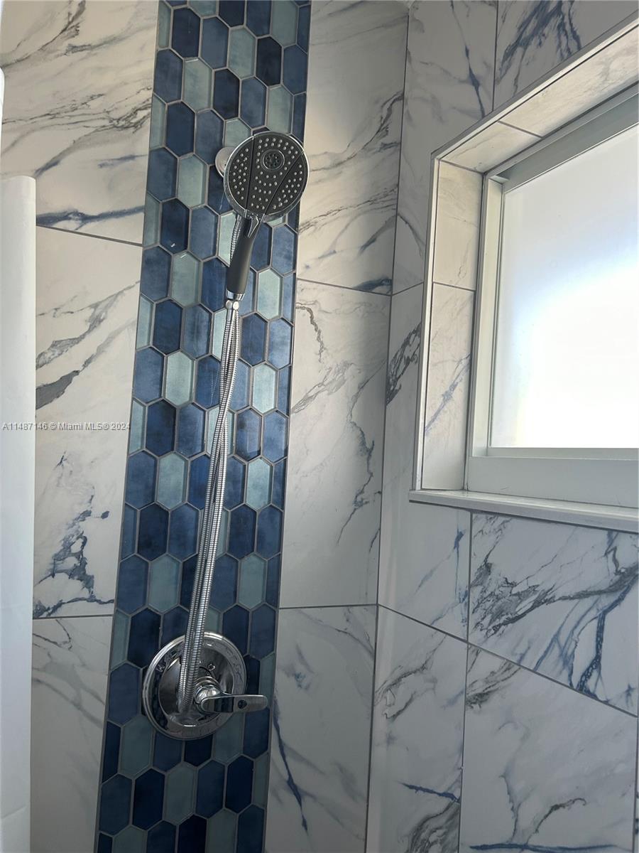 1215 97th Street, Unit 11 Marathon, FL 33050 - Photo 16 of 25 a bathroom with a shower