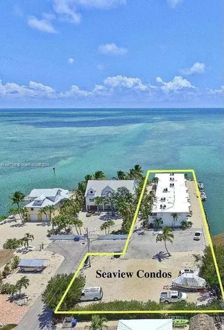 a view of a swimming pool with an ocean view