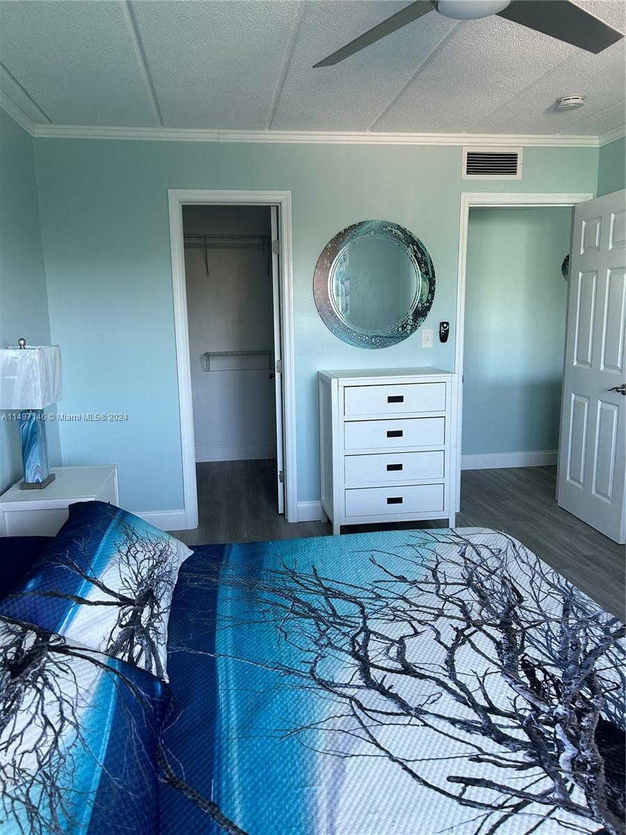 1215 97th Street, Unit 11 Marathon, FL 33050 - Photo 21 of 25 a living room with furniture and a mirror