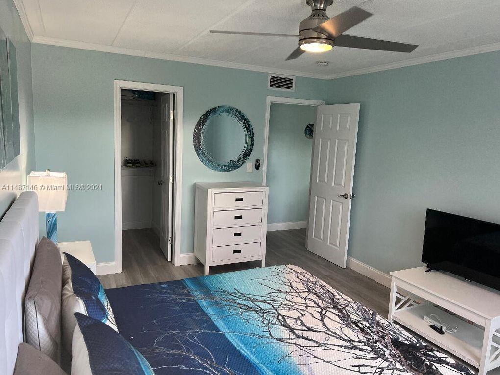 1215 97th Street, Unit 11 Marathon, FL 33050 - Photo 25 of 25 a bedroom with a bed and furniture