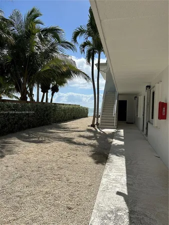 a view of a house with balcony and garden
