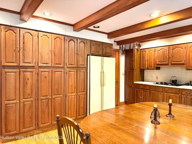 a view of a kitchen with a refrigerator