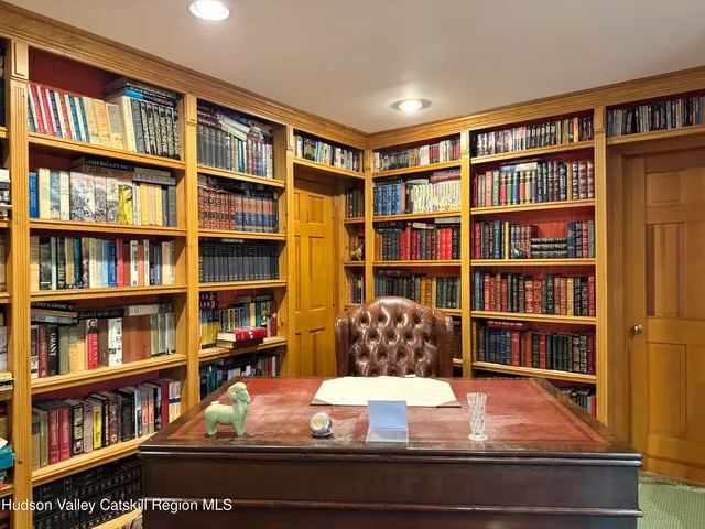 a room with bookshelf and a book shelf