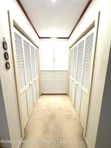 a bathroom with a sink a mirror and a shower