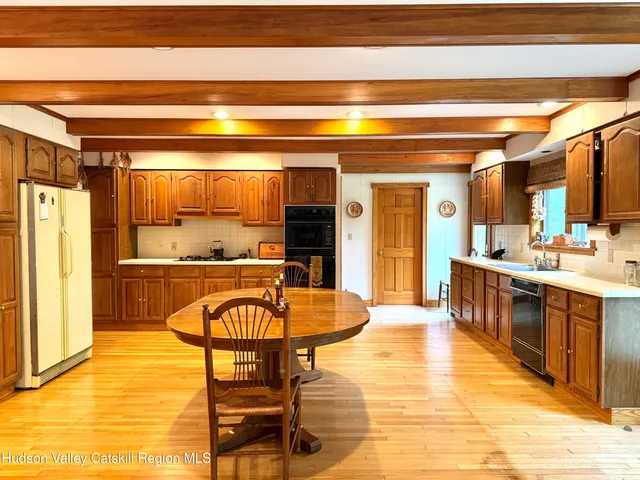 a living room with a table and chairs