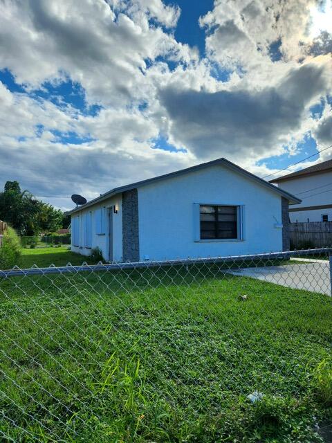 1565 West 36th Street Riviera Beach, FL 33404 - Photo 1 of 8 PHOTO-2023-10-16-16-13-24_1 - Copy
