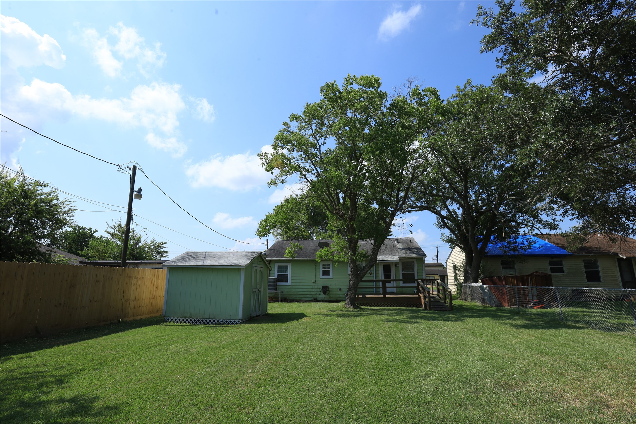 726 West 8th Street Freeport, TX 77541 - Photo 15 of 18 Large backyard with storage building