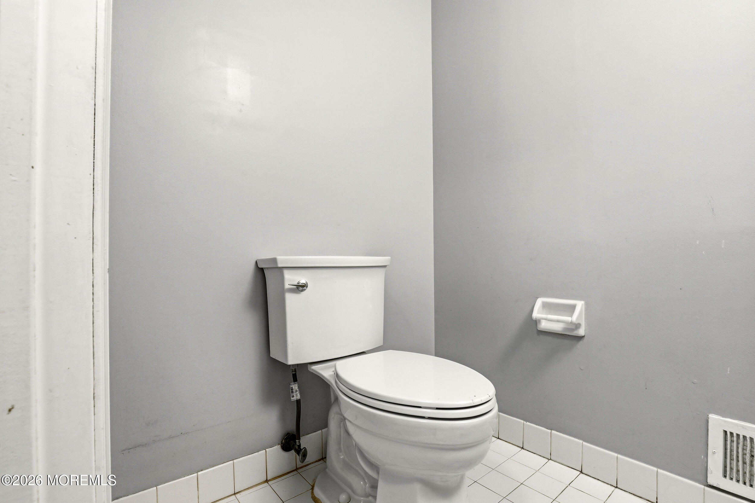 2055 MacKenzie Road Toms River, NJ 08755 - Photo 21 of 56 a white toilet sitting next to a shower
