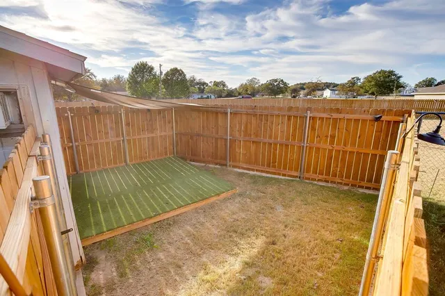 a view of a yard with an ocean