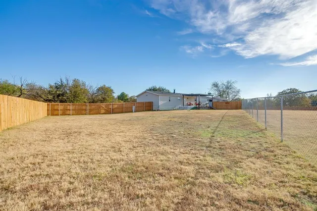 a view of a two chairs in the balcony
