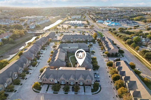 an aerial view of houses with outdoor space