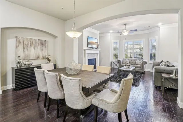 a view of a dining room with furniture wooden floor and chandelier