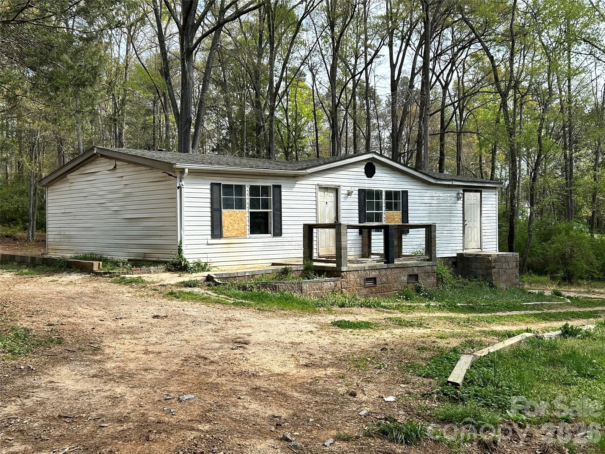 2137 Plumcrest Lane Clover, SC 29710 - Photo 2 of 23 a view of a yard in front of a house with large tree