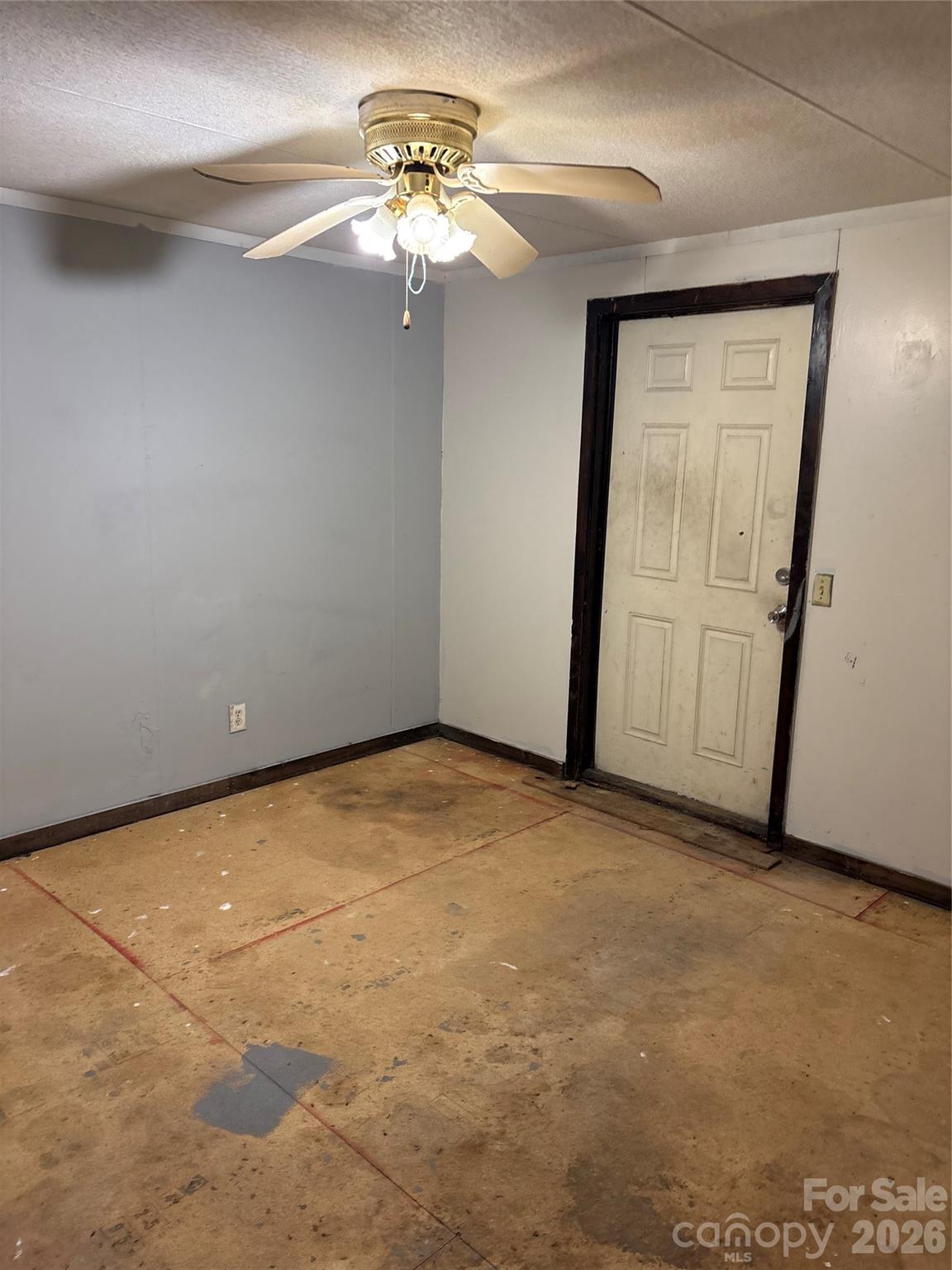 2137 Plumcrest Lane Clover, SC 29710 - Photo 6 of 23 an empty room with a chandelier fan and windows