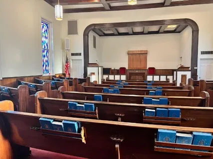 a view of dinning table with chairs