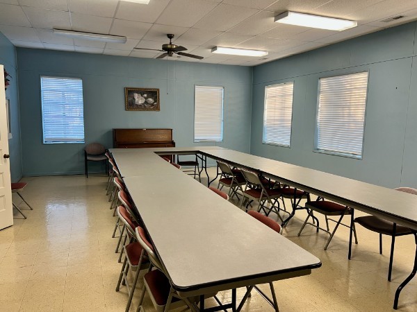 501 West Broad Street Decherd, TN 37324 - Photo 6 of 14 a kitchen with a table chairs and a refrigerator