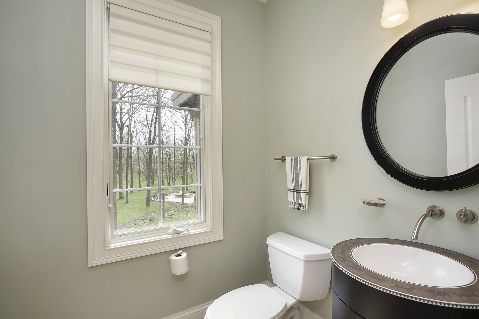 10309 Lawrence Road Harvard, IL 60033 - Photo 23 of 56 a bathroom with a toilet a sink and a mirror