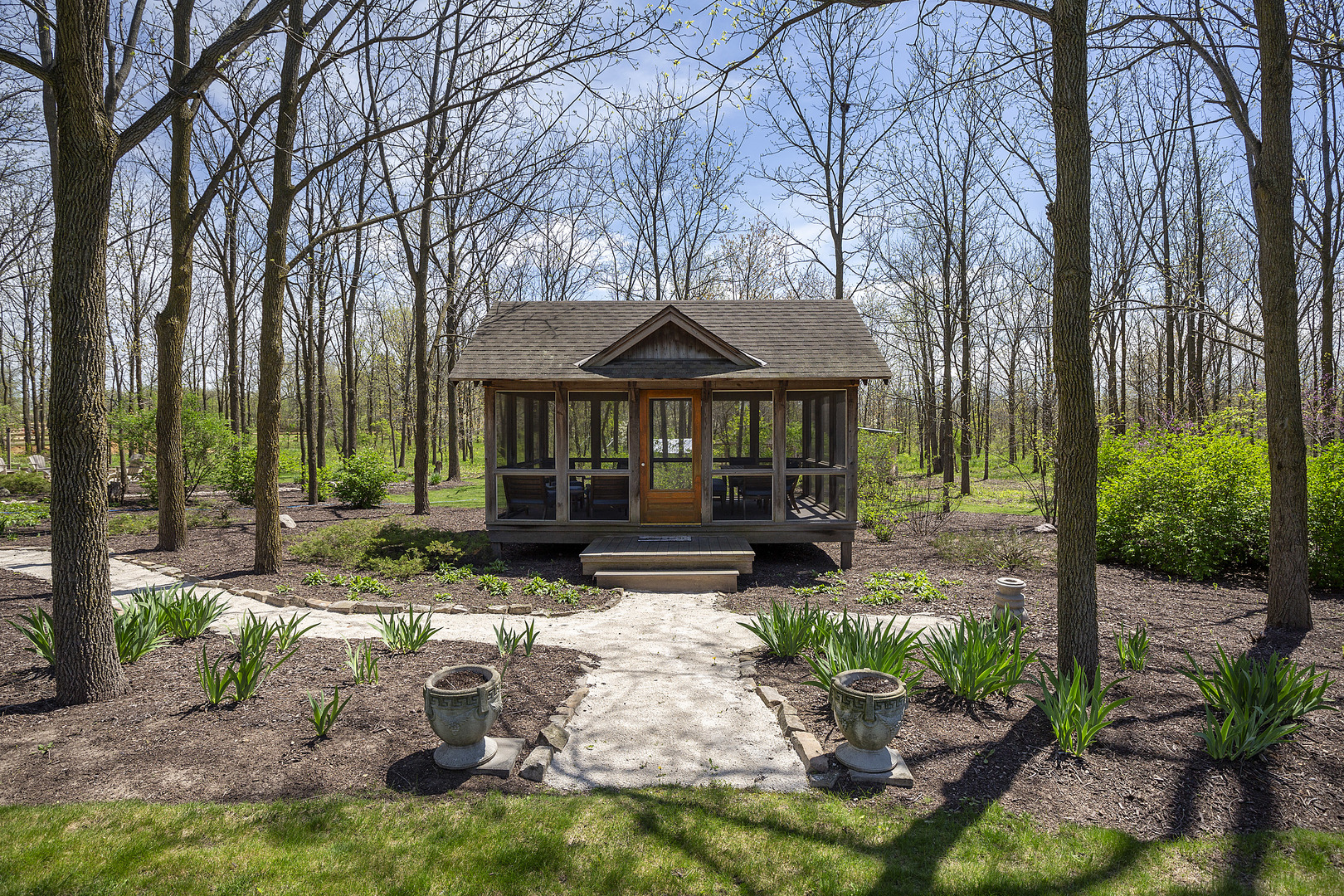 10309 Lawrence Road Harvard, IL 60033 - Photo 45 of 56 a view of a patio with table and chairs under an umbrella