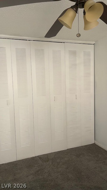 350 East Desert Inn Road, Unit B103 Las Vegas, NV 89109 - Photo 18 of 22 Functional louvered closet doors and a ceiling fan enhance this cozy bedroom space.