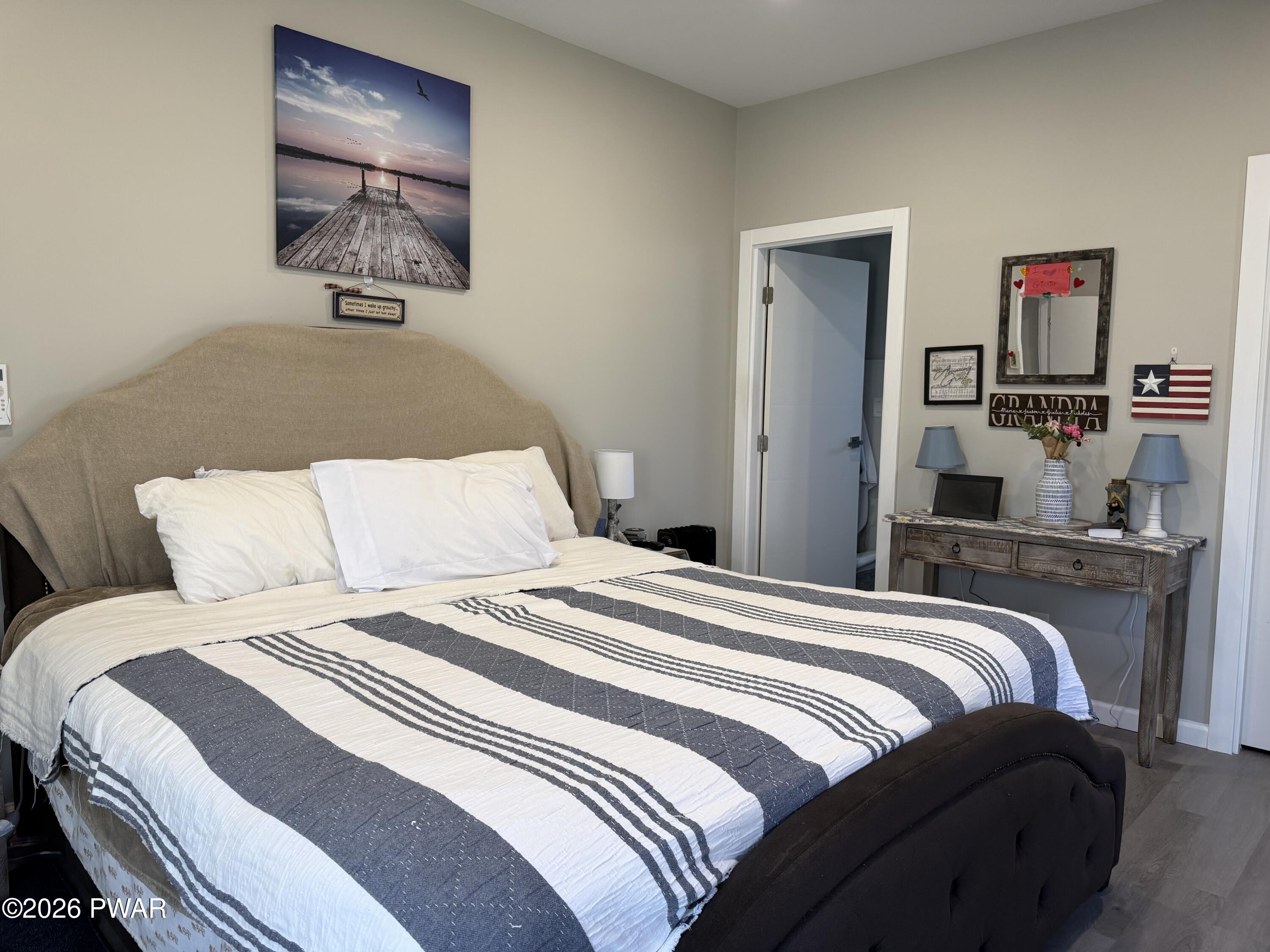 801 Maple Ridge Court Hawley, PA 18428 - Photo 21 of 55 a bedroom with a bed and a desk
