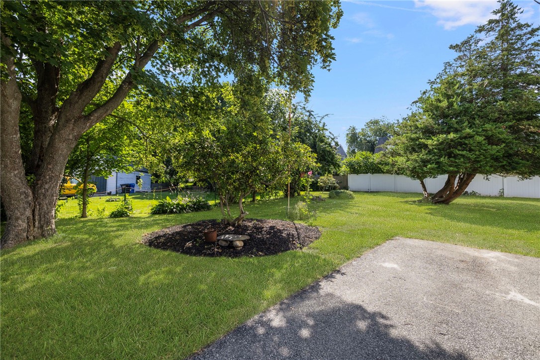 Oversized side yard to North of house also showing driveway at 9 Cummings