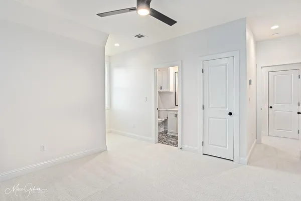 a bathroom with a double vanity sink toilet mirror and bathtub
