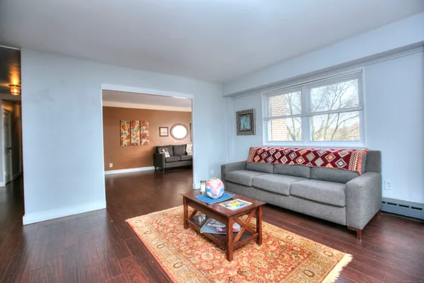 a view of hallway with wooden floor
