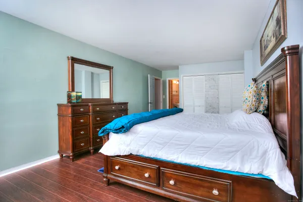 a living room with a bed furniture and a window