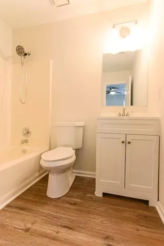 a view of a hallway with a room