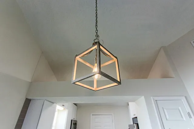 a bathroom with a granite countertop sink toilet and a mirror