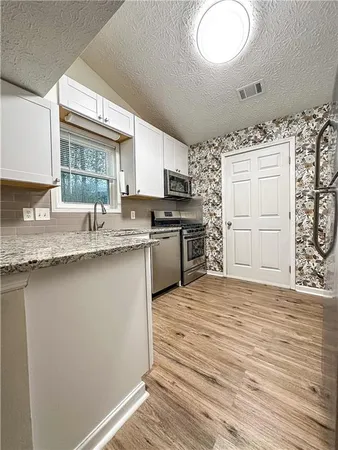 a bathroom with a sink and a granite