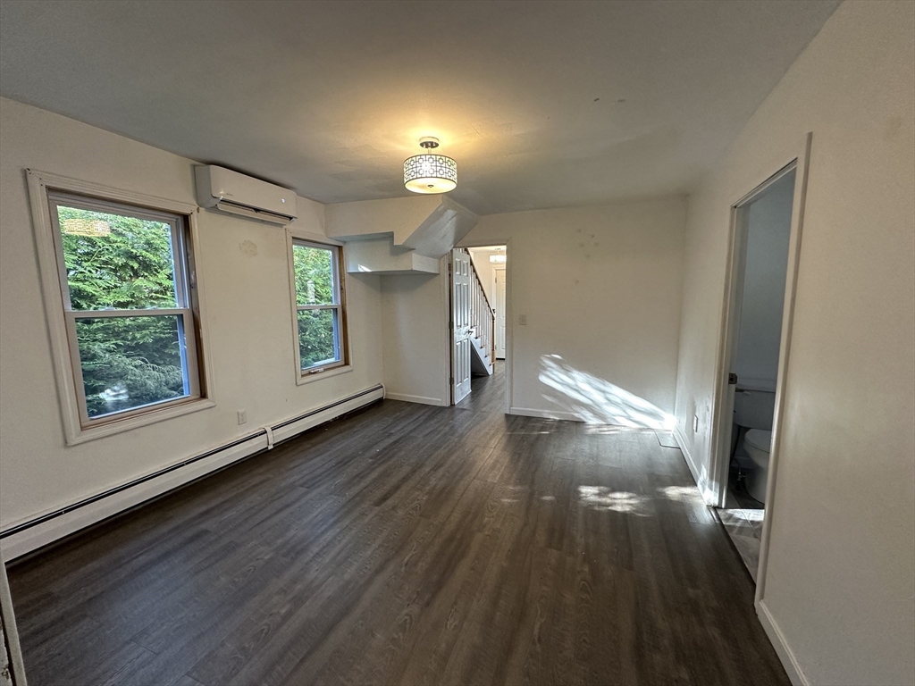 8 Pike Street Hopkinton, MA 01748 - Photo 24 of 34 a view of empty room with wooden floor and fan
