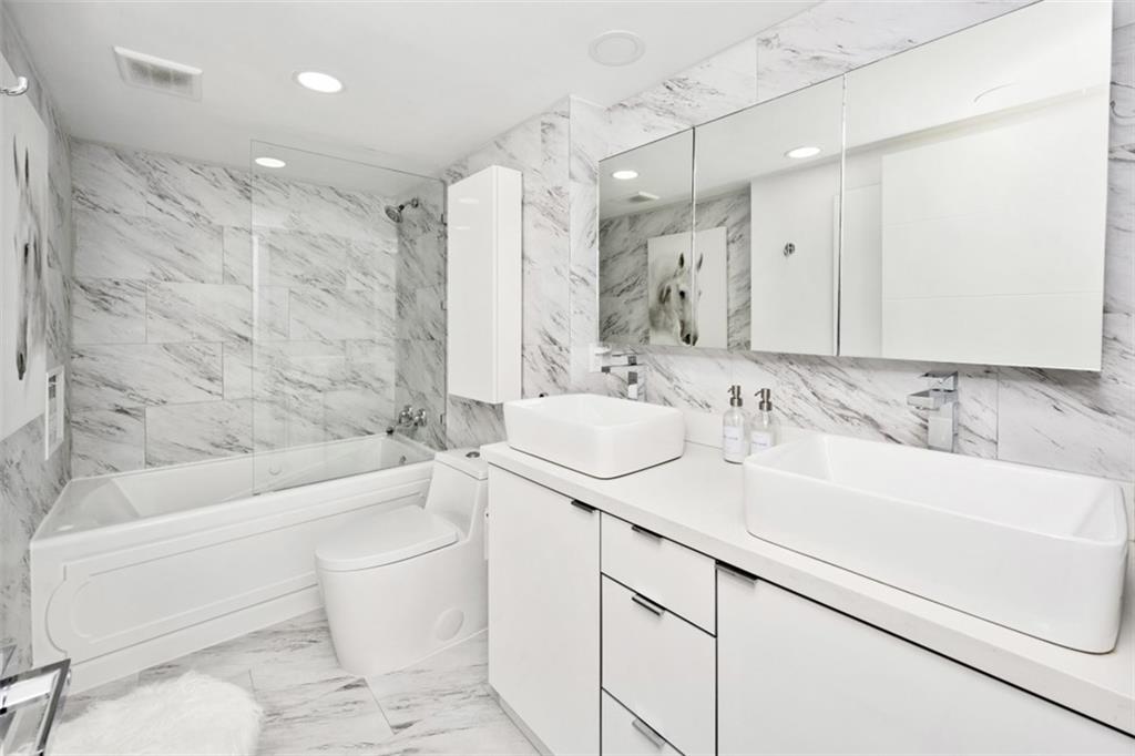 555 Northeast 15th Street, Unit 32C Miami, FL 33132 - Photo 15 of 21 a bathroom with a sink toilet vanity and bathtub