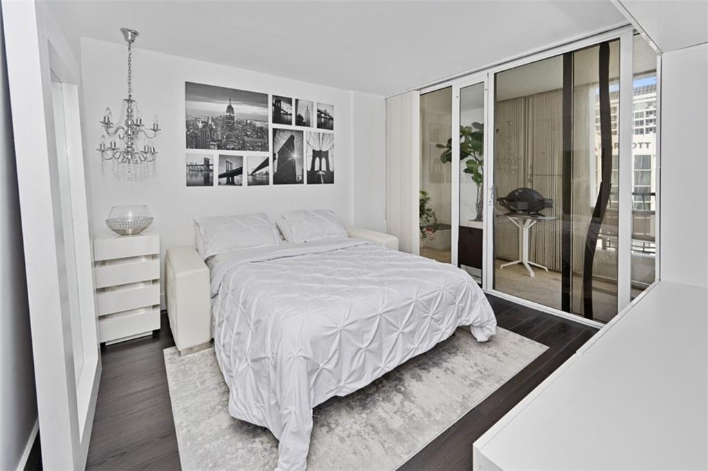 555 Northeast 15th Street, Unit 32C Miami, FL 33132 - Photo 16 of 21 a bedroom with a bed and a window