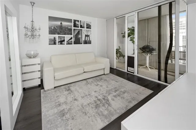 a living room with furniture and a rug