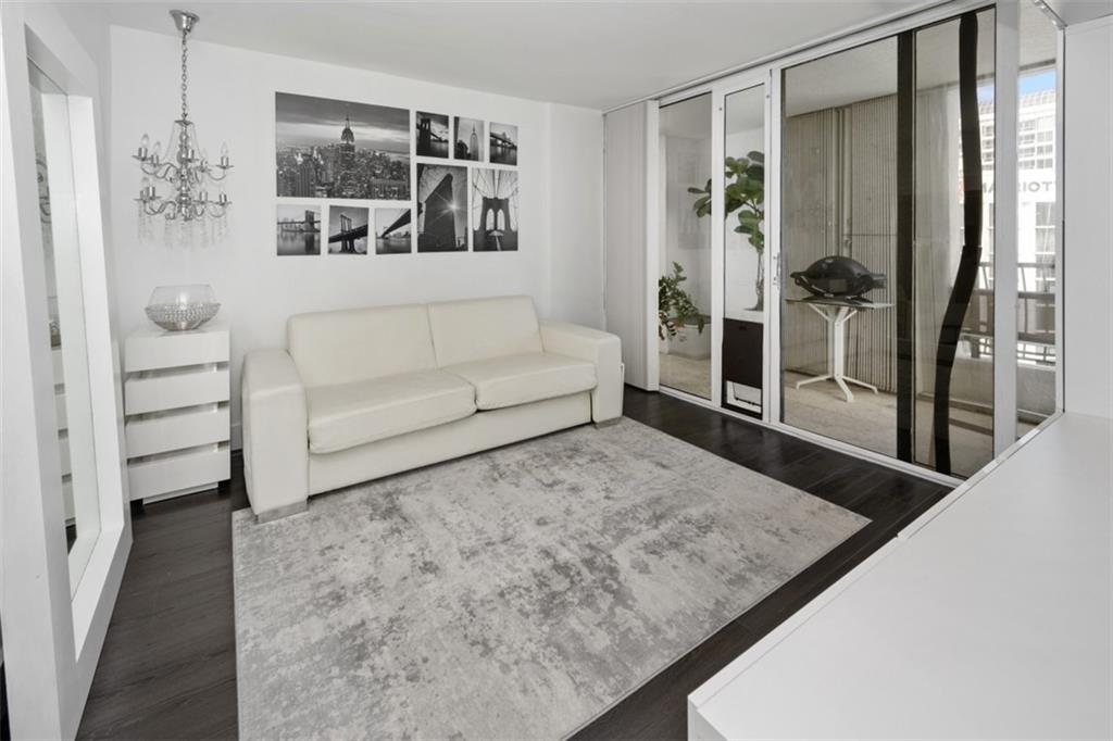 555 Northeast 15th Street, Unit 32C Miami, FL 33132 - Photo 18 of 21 a living room with furniture and a rug