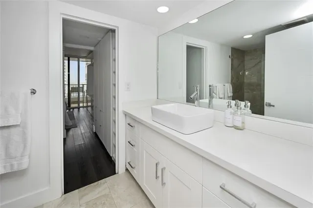 a bathroom with a sink and mirror