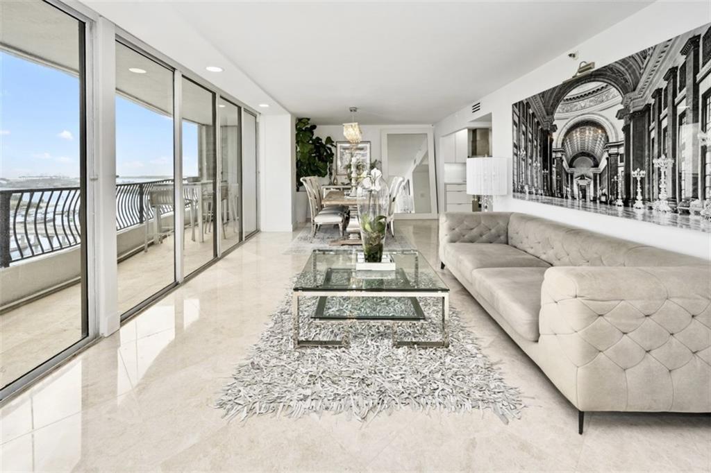 555 Northeast 15th Street, Unit 32C Miami, FL 33132 - Photo 3 of 21 a living room with furniture fireplace and a rug