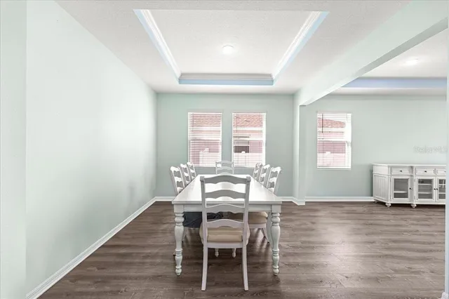 an empty room with wooden floor and a window