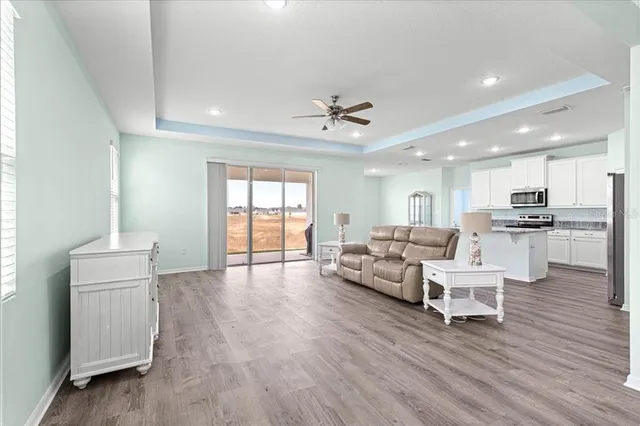 a spacious bathroom with a tub sink and mirror