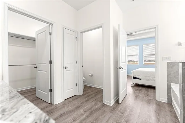 a bedroom with a bed and dresser