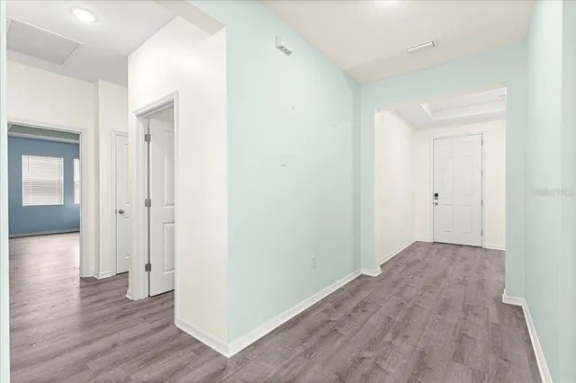 a en suite bathroom with a granite countertop sink and a mirror