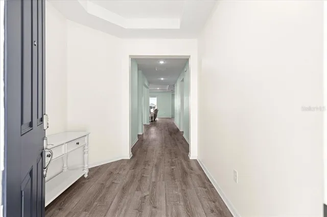 a kitchen with stainless steel appliances kitchen island granite countertop a sink and cabinets