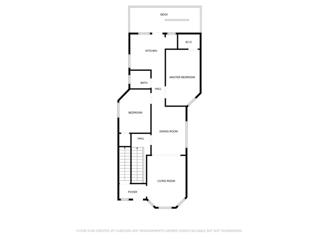 a picture of a bench in front of a wall