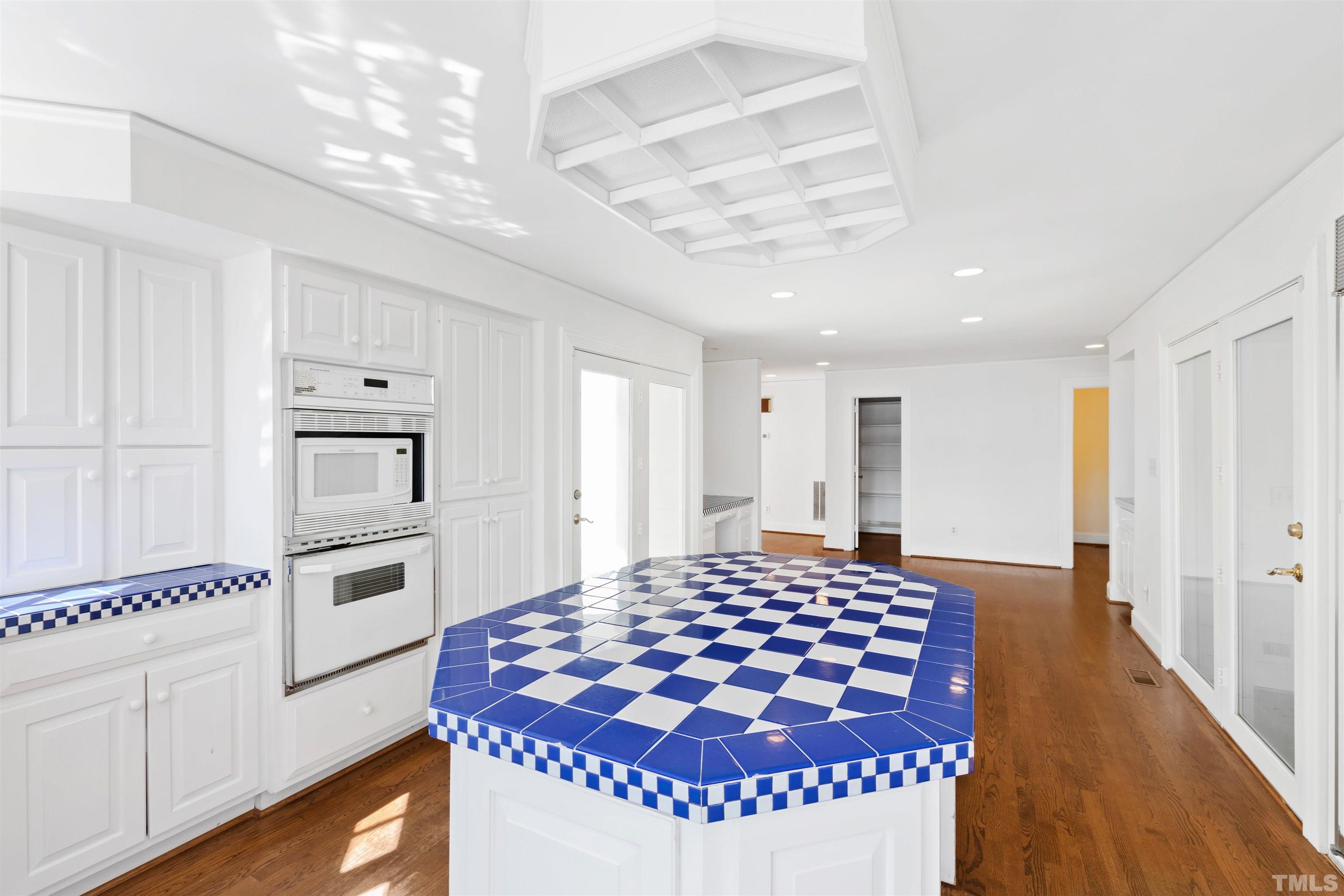 1718 Canterbury Road Raleigh, NC 27608 - Photo 13 of 30 a kitchen with granite countertop stainless steel appliances a stove a sink and a refrigerator