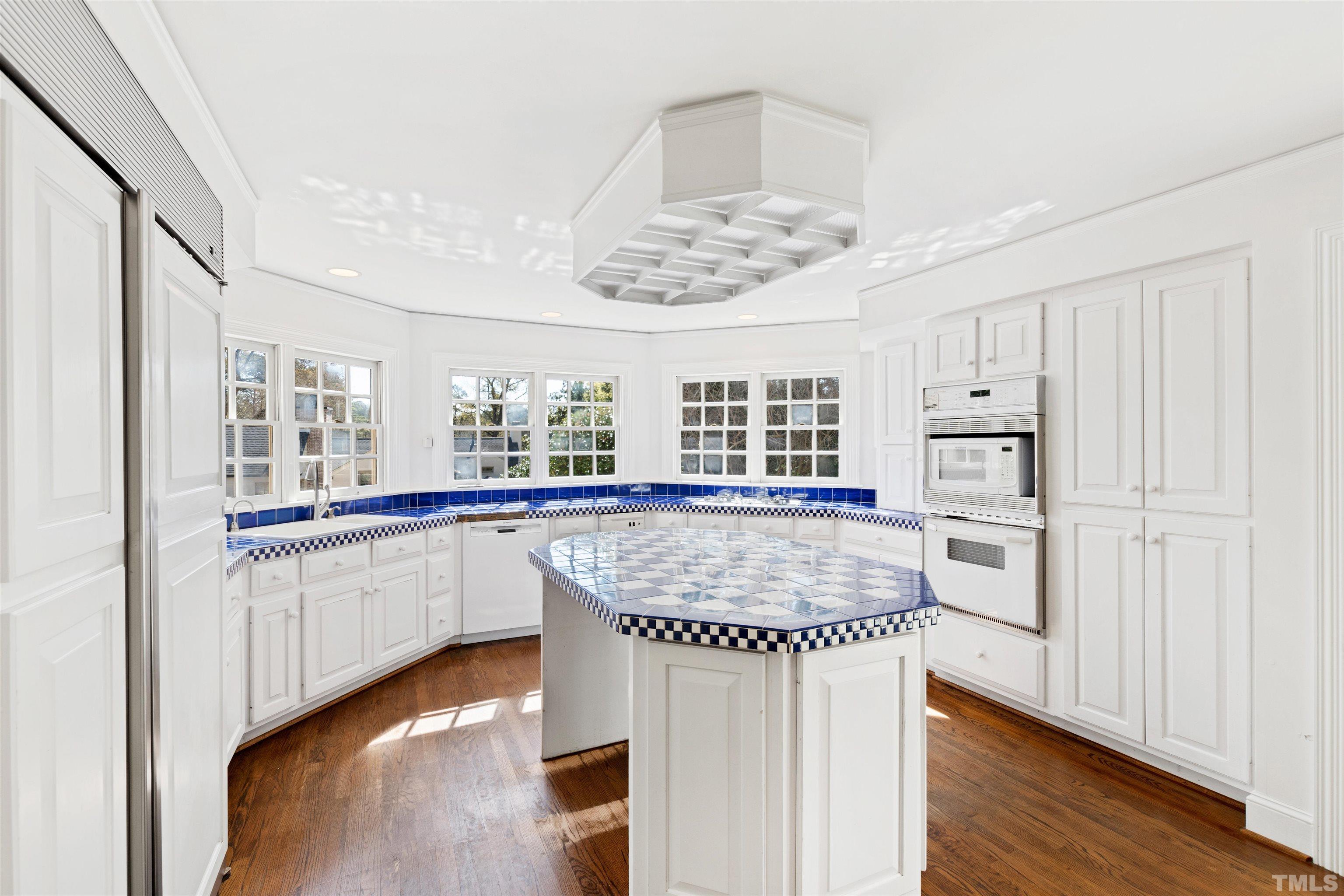 1718 Canterbury Road Raleigh, NC 27608 - Photo 16 of 30 a kitchen with stainless steel appliances granite countertop a sink stove and refrigerator